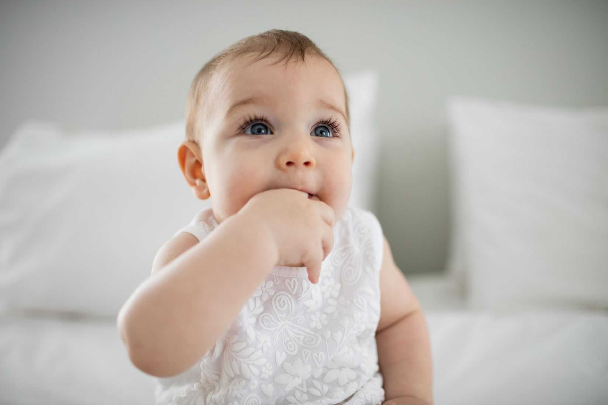 baby sucking her finger